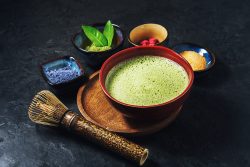 Matcha Nedir? Neden Bu Kadar Popüler Oldu? | Sağlık ve Zen Dolu Bir Yolculuk Various matcha tea powders on a dark concrete background. Top view.